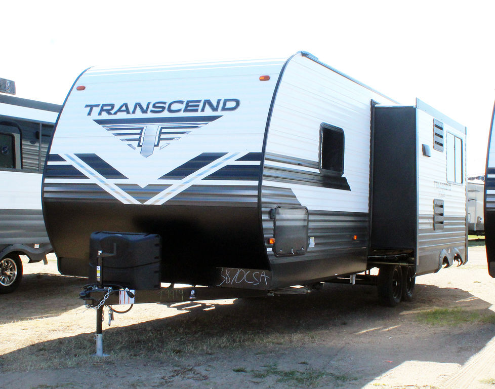 A white & black 2020 Grand Design 261BH Bunkhouse RV parked in an RV lot. 